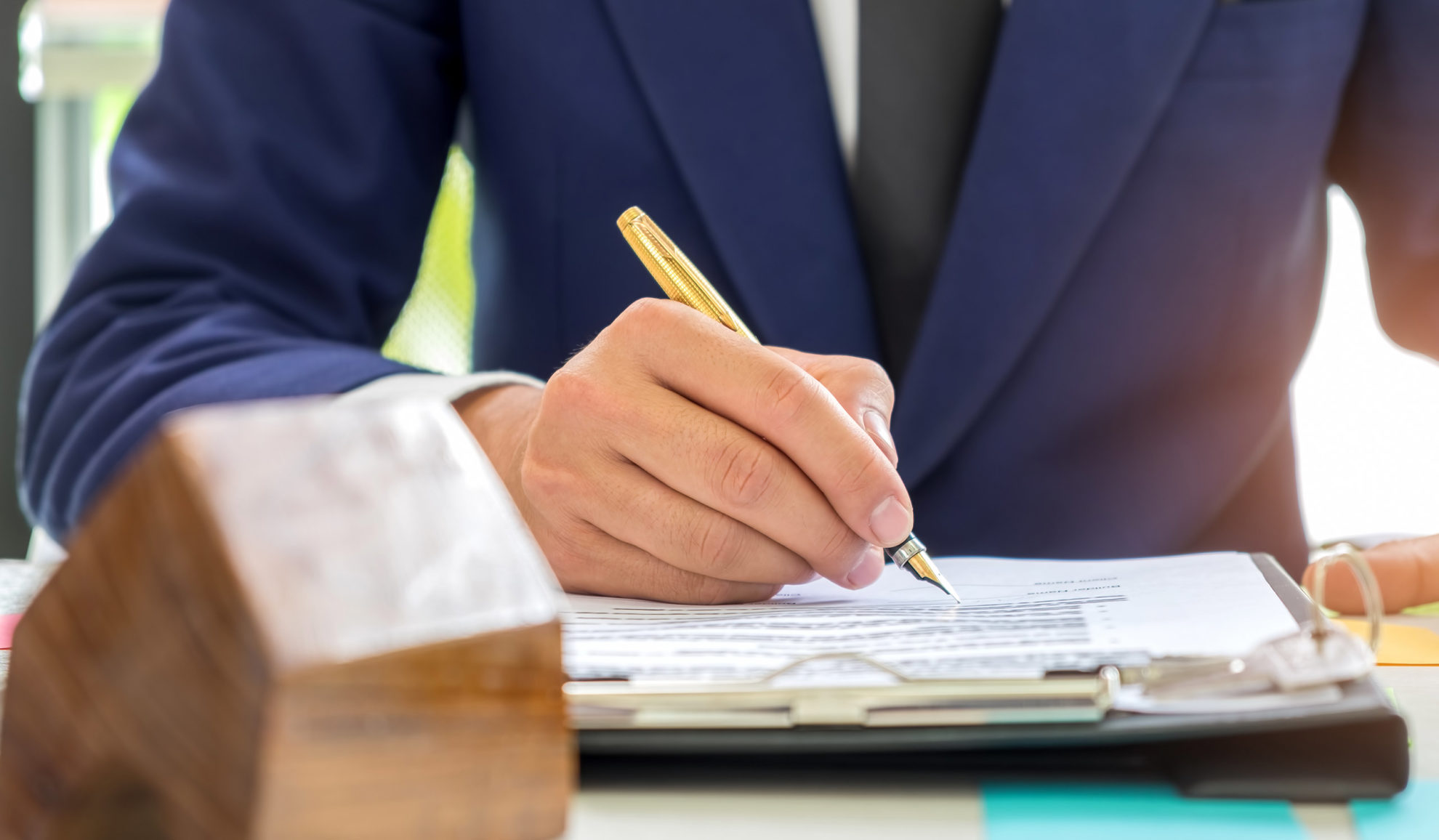 estate-planning-lawyer-signing-documents-at-desk-novato-ca